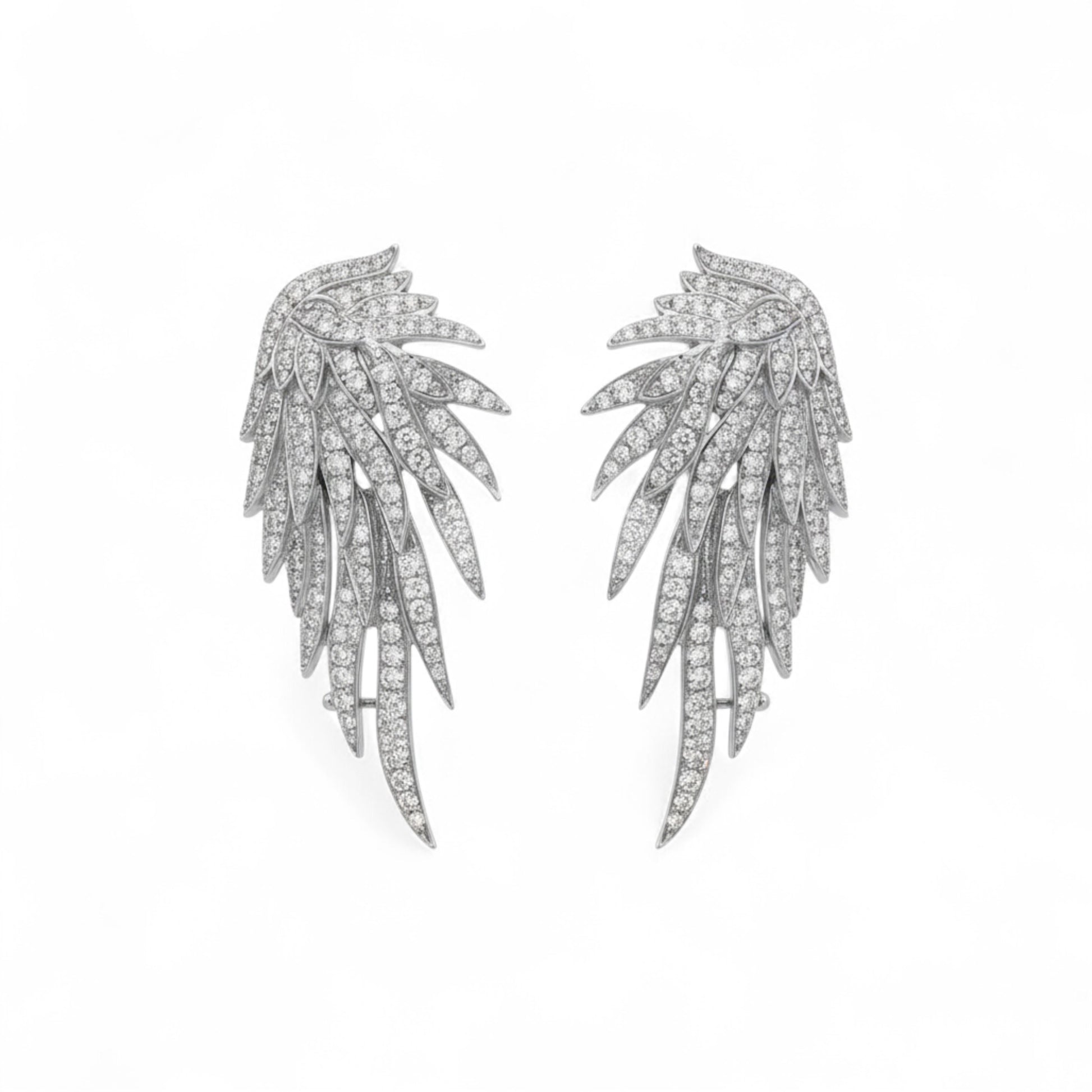 Pair of silver leaf-shaped earrings on a white background