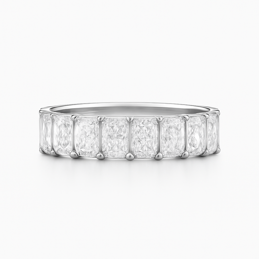 Diamond ring with emerald-cut stones on a white background
