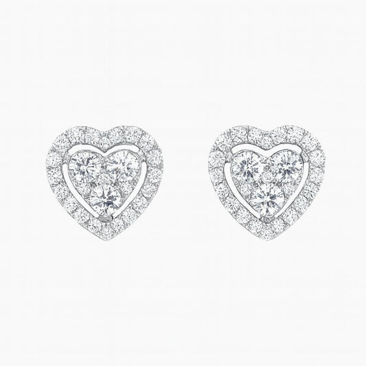 Heart-shaped earrings with clear gemstones on a white background