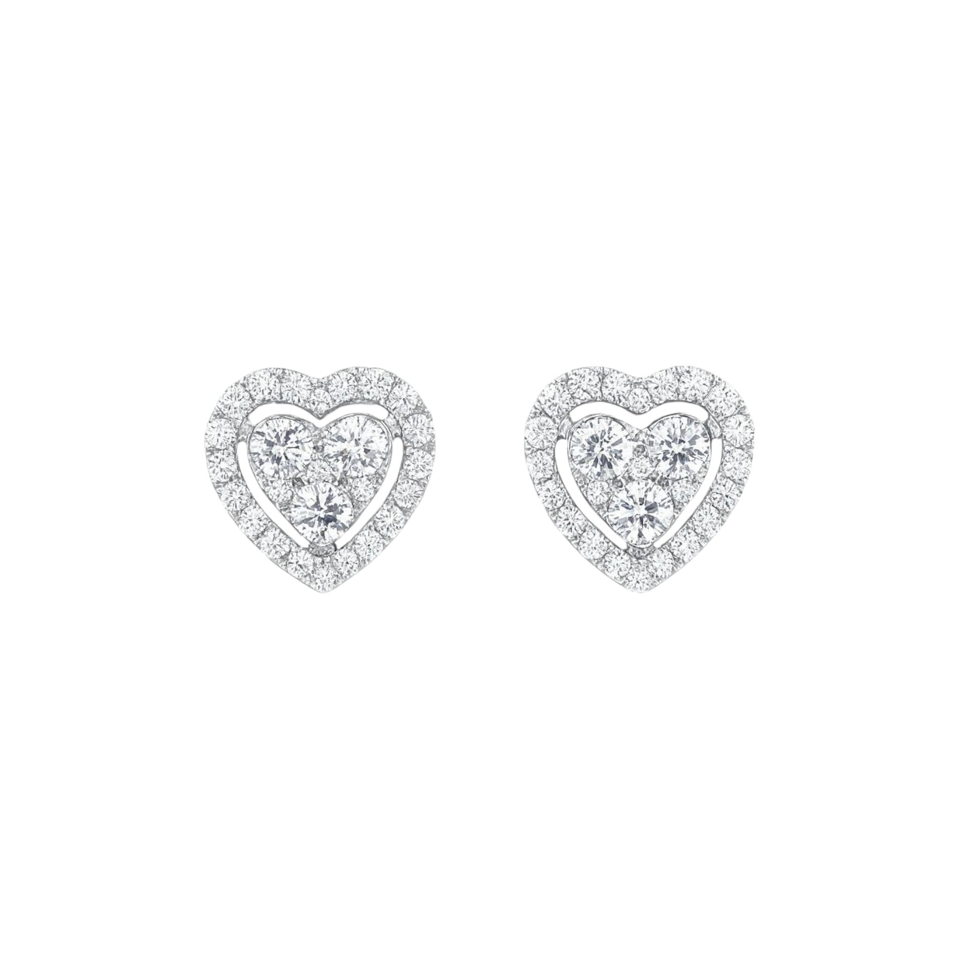 Heart-shaped diamond earrings on a white background