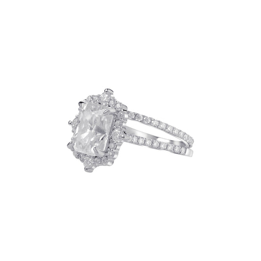 Diamond ring with a large central gemstone and smaller stones on a white background