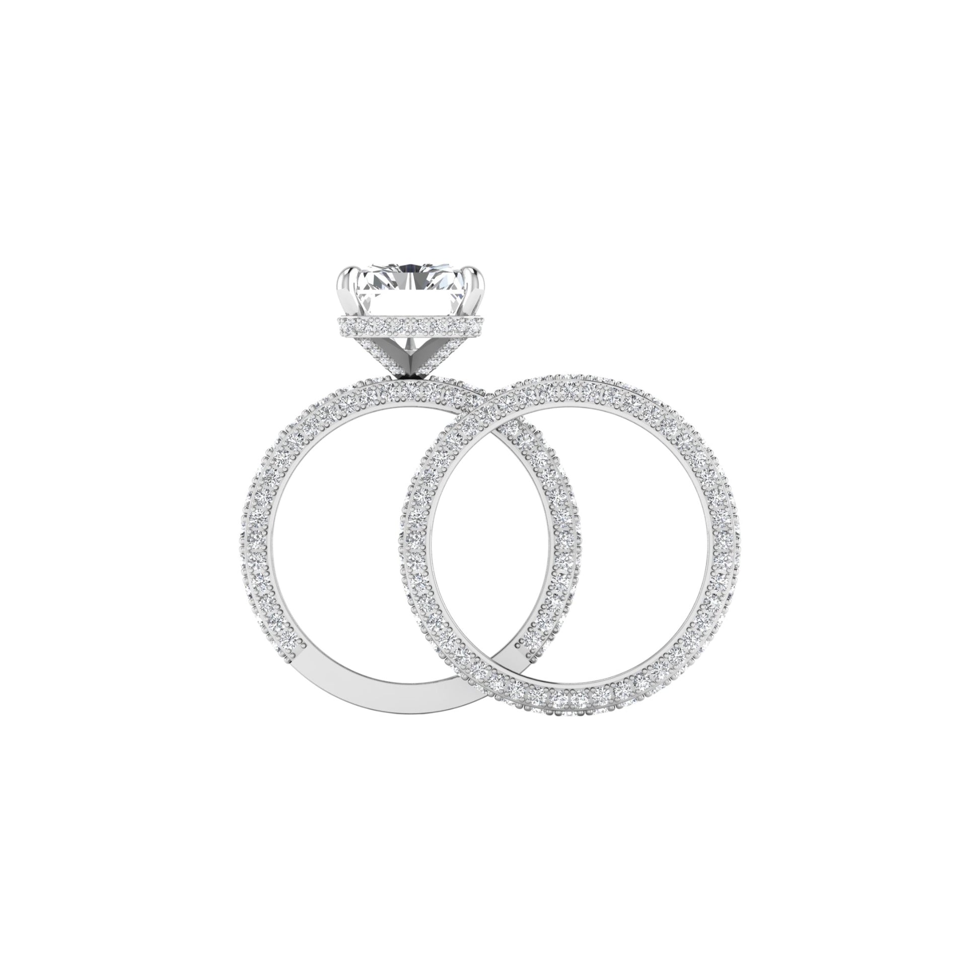 Diamond ring with a larger round diamond and smaller circular diamonds on a white background