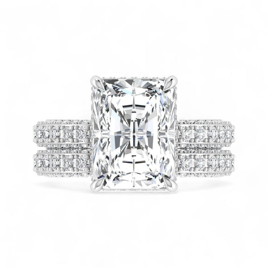 Diamond ring with emerald-cut center stone and diamond band on a white background