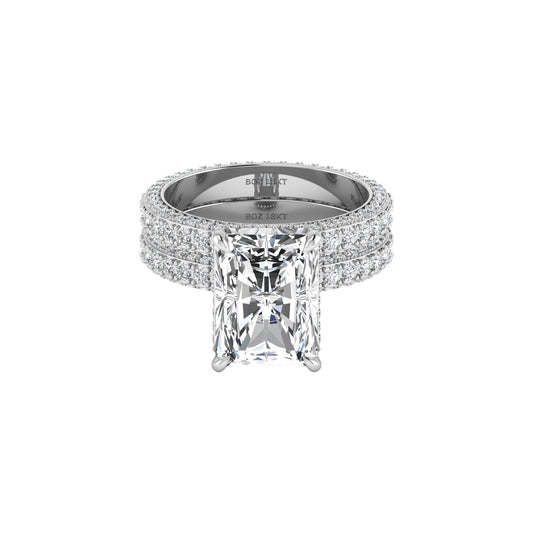 Diamond ring with a large central gemstone and smaller stones on a white background