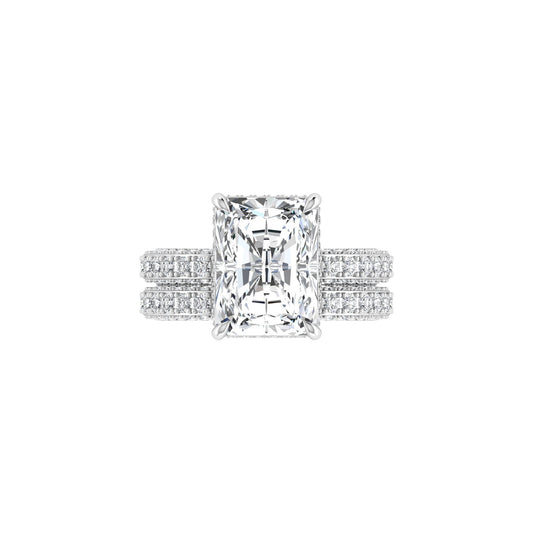 Diamond ring with a rectangular cut gemstone on a white background