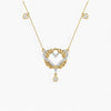 Gold and diamond heart-shaped necklace on a white background