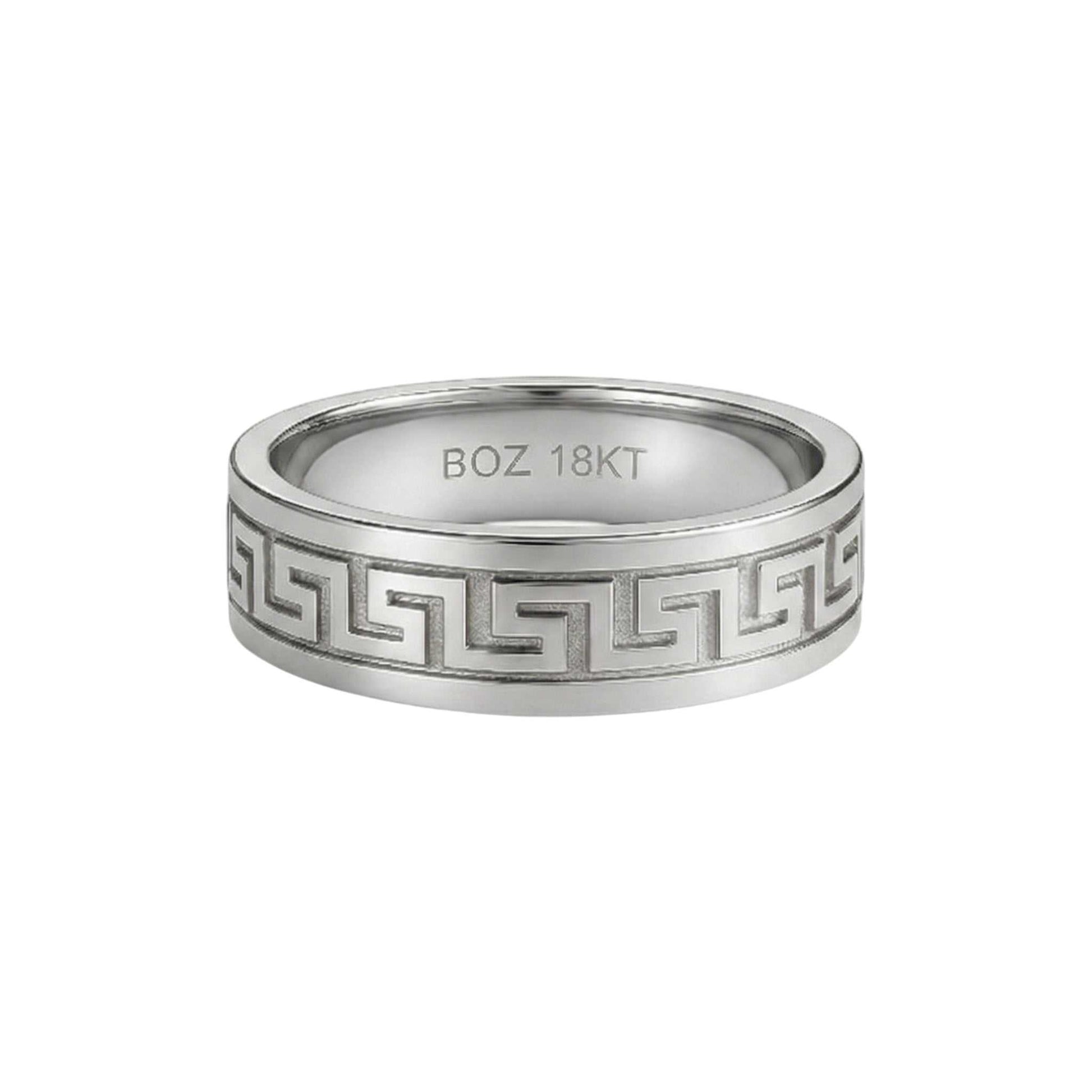 Silver ring with intricate design and 'BOZ 18KT' engraving on a white background