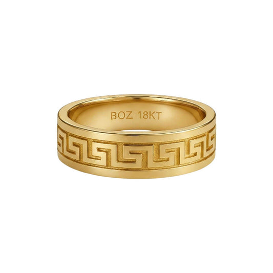 Gold ring with intricate design and 'BOZ 18KT' engraving on a white background