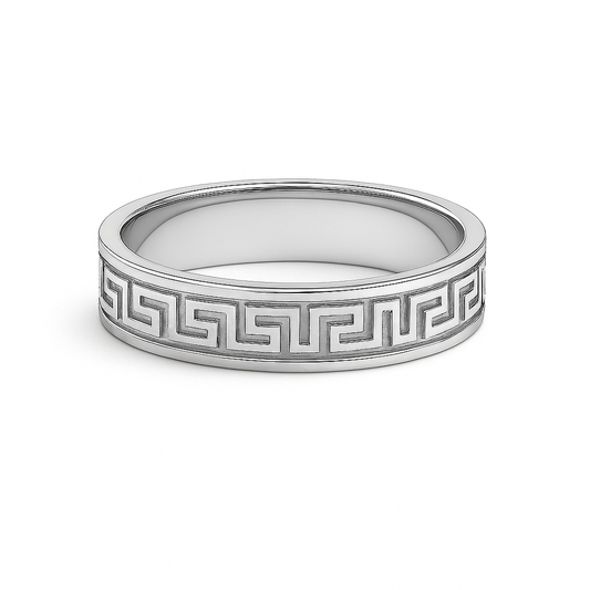 Silver ring with Greek key design on a white background