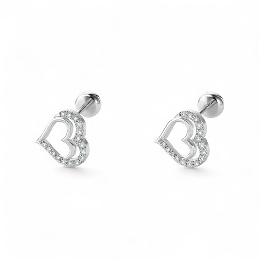 Heart-shaped silver earrings on a white background