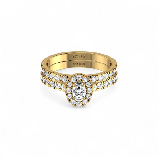 Gold ring with diamond accents on a white background