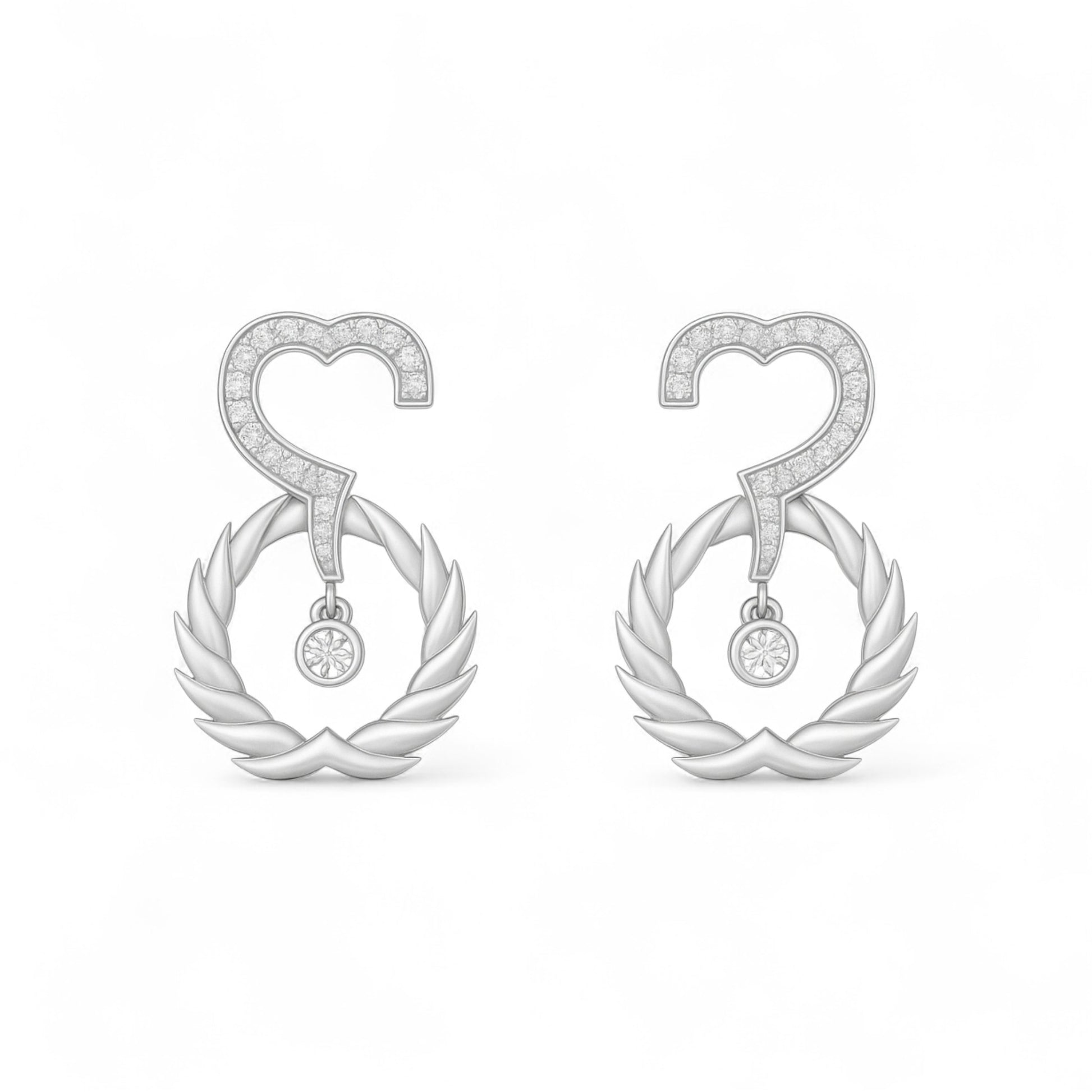 Pair of silver earrings with heart and wreath design on a white background