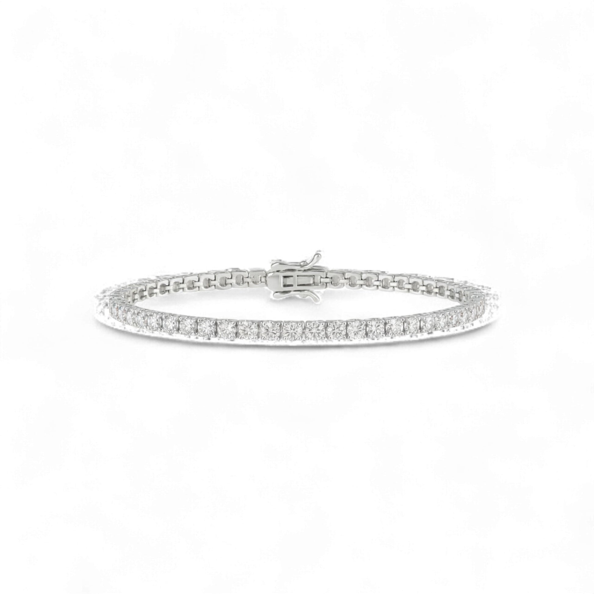 Silver bracelet with small diamonds on a white background
