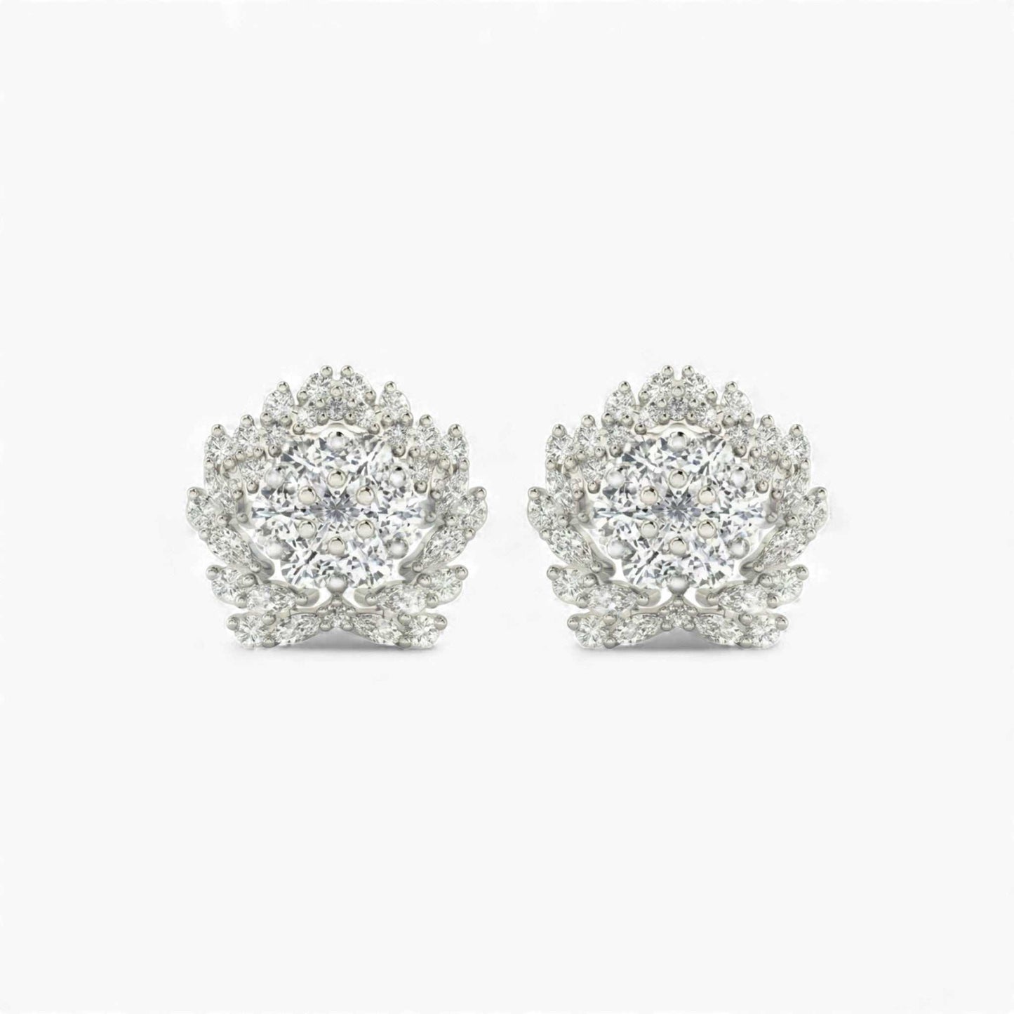 Pair of silver earrings with clear gemstones on a white background