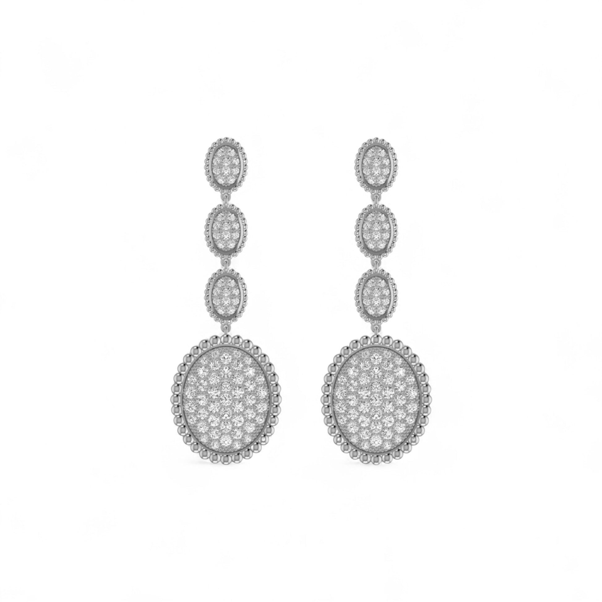 Pair of silver earrings with clear stones on a white background