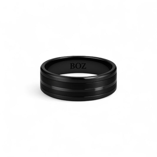 Black ring with 'BOZ' engraving on a white background