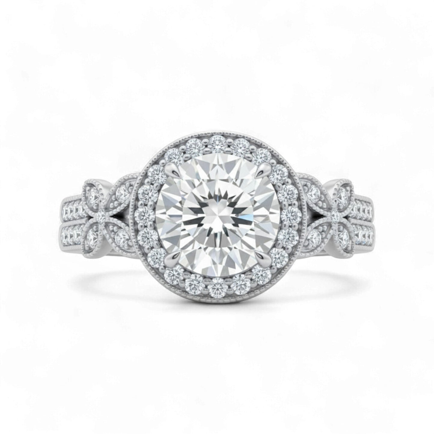 Silver ring with a large diamond and smaller diamonds on the band against a white background