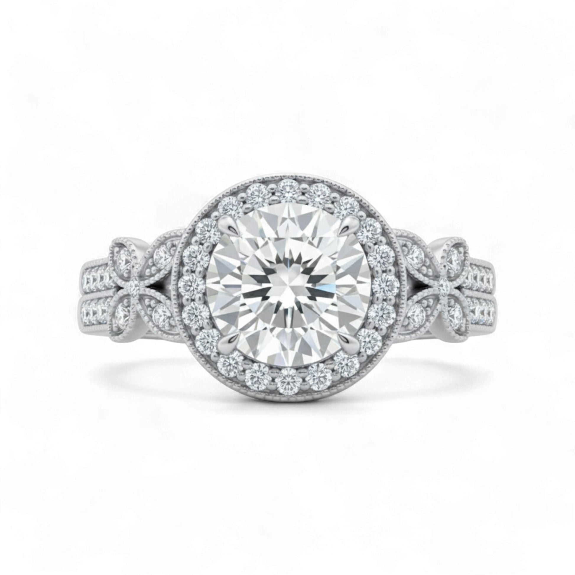 Silver ring with a large diamond and smaller diamonds on the band against a white background