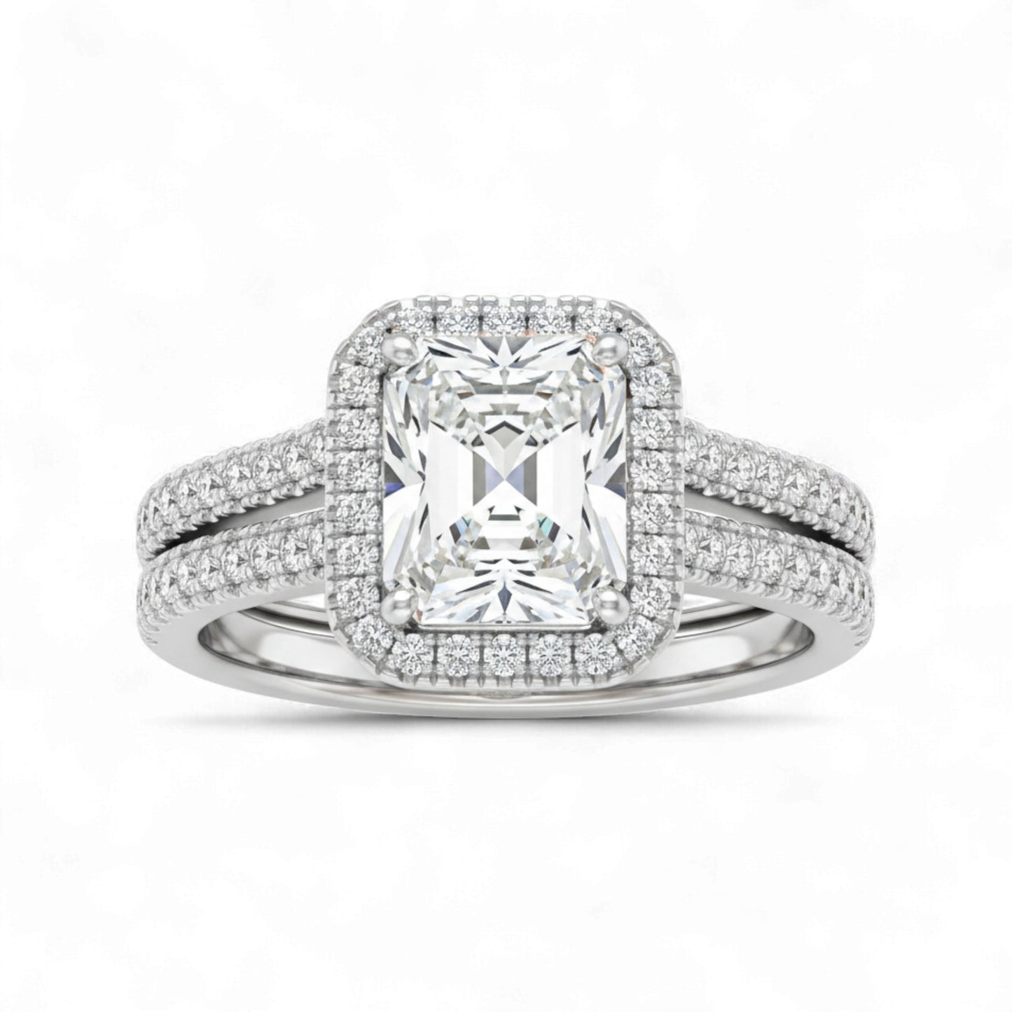Diamond ring with a rectangular center stone on a white background