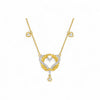 Gold necklace with a heart-shaped pendant on a white background