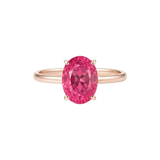 Rose gold ring with a pink gemstone on a white background