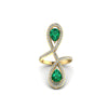 An 18K gold ring with a red center stone and diamond accents
