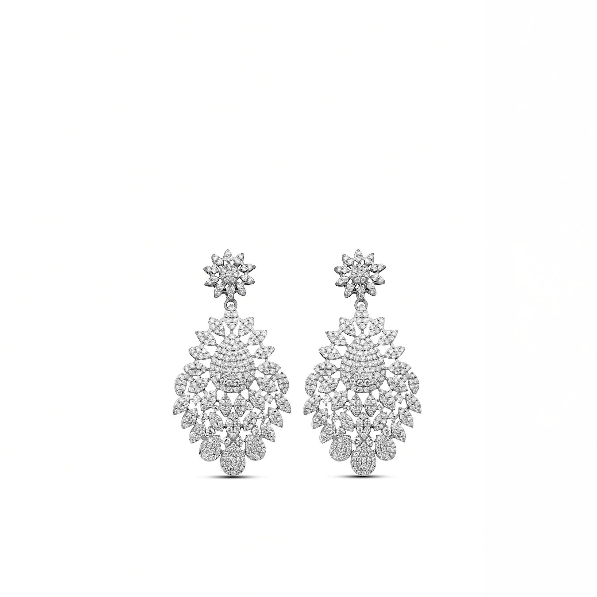 A pair of 18 karat gold drop earrings encrusted with natural diamonds