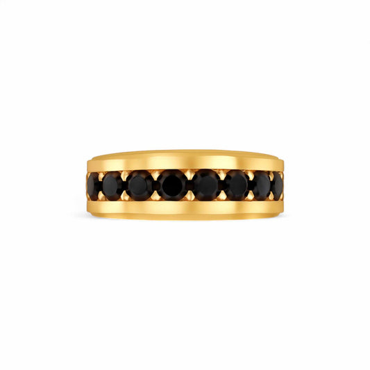 Gold ring with black gemstones on a white background
