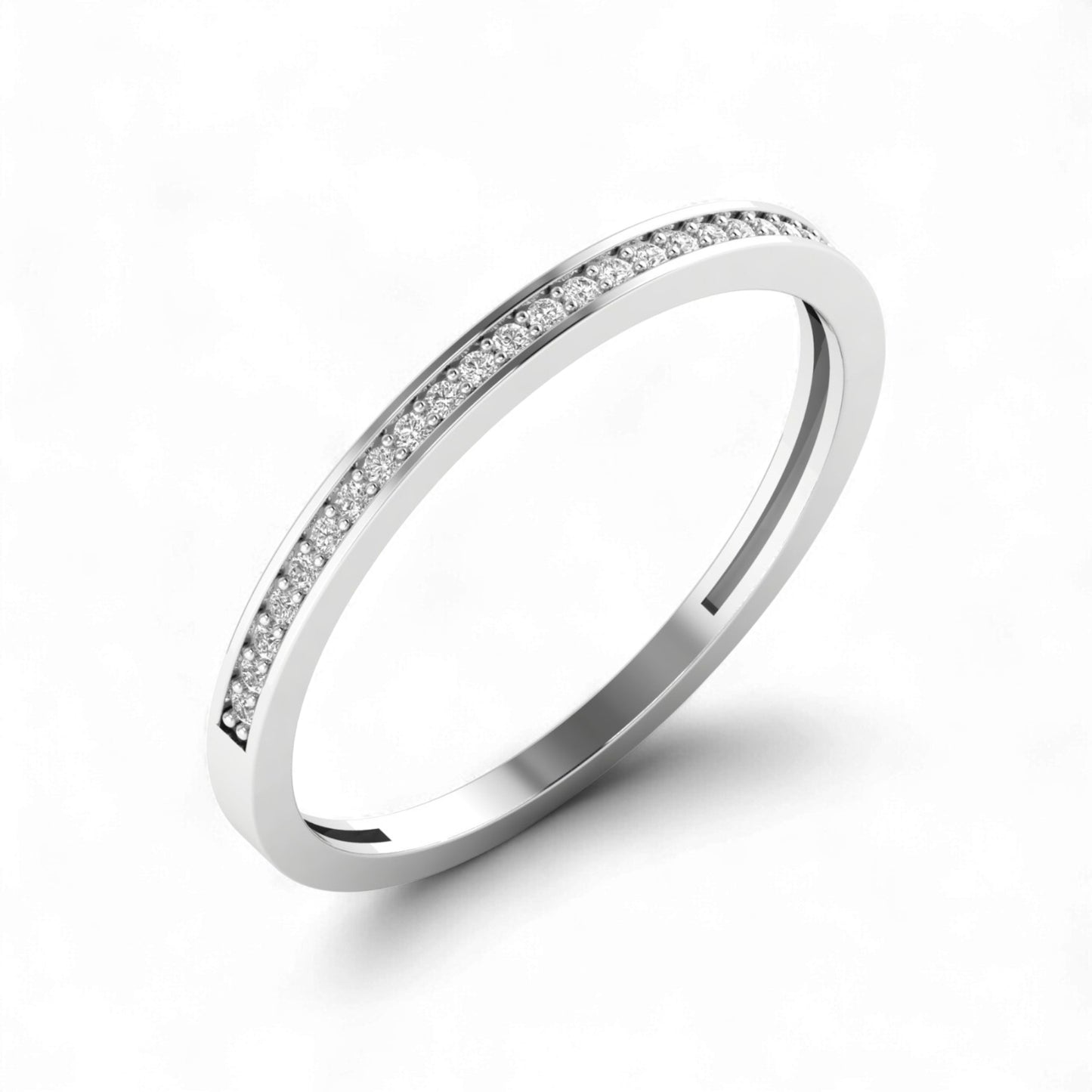 Silver ring with small diamonds on a white background
