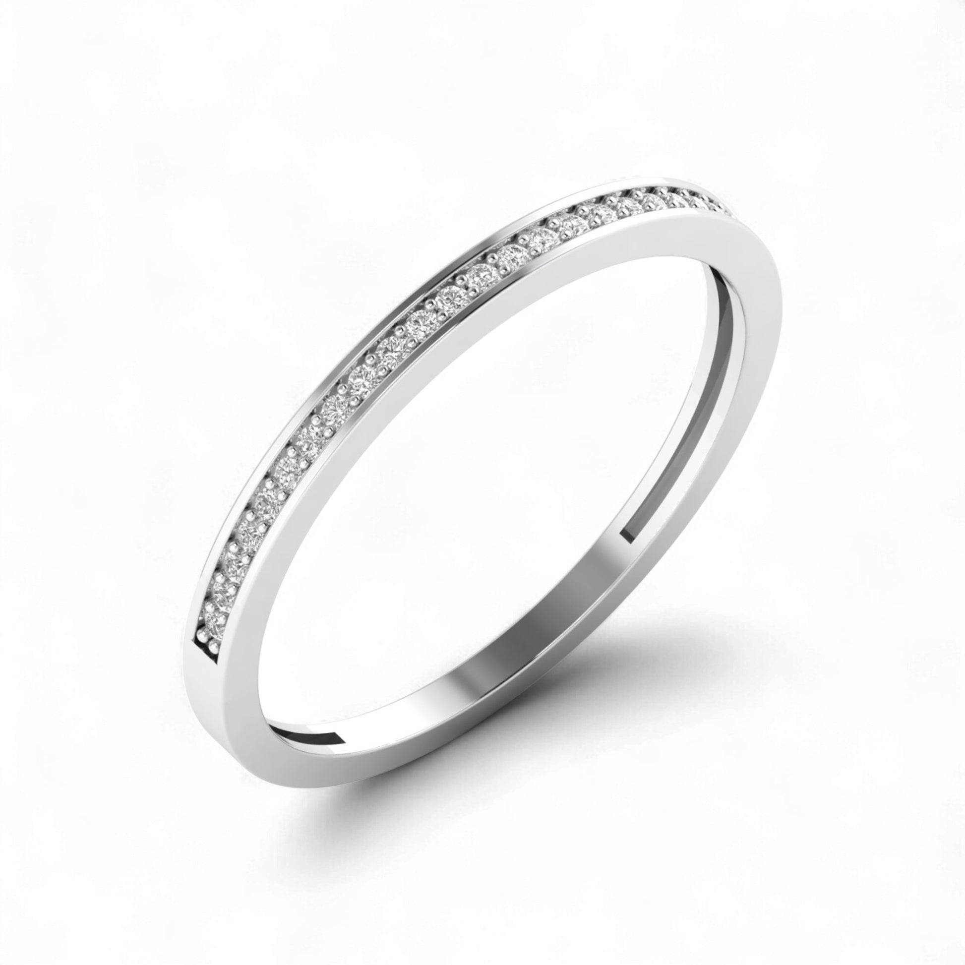 Silver ring with small diamonds on a white background