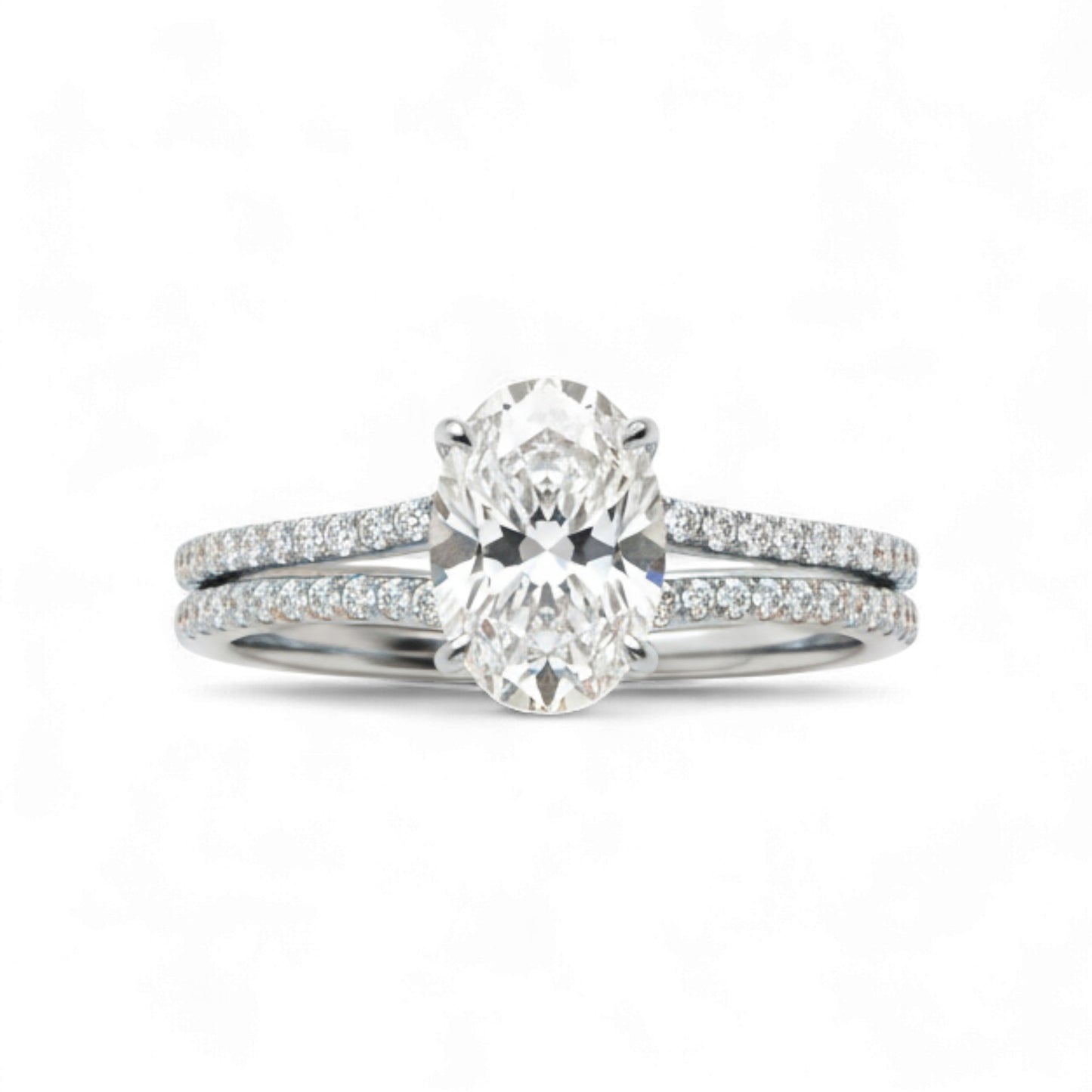 Diamond ring with a matching band on a white background