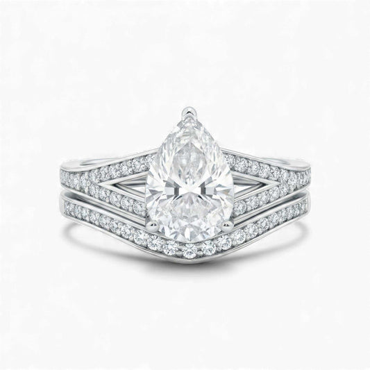 Split Shank Pear Cut Moissanite bridal set in 925 sterling silver with pavé accents