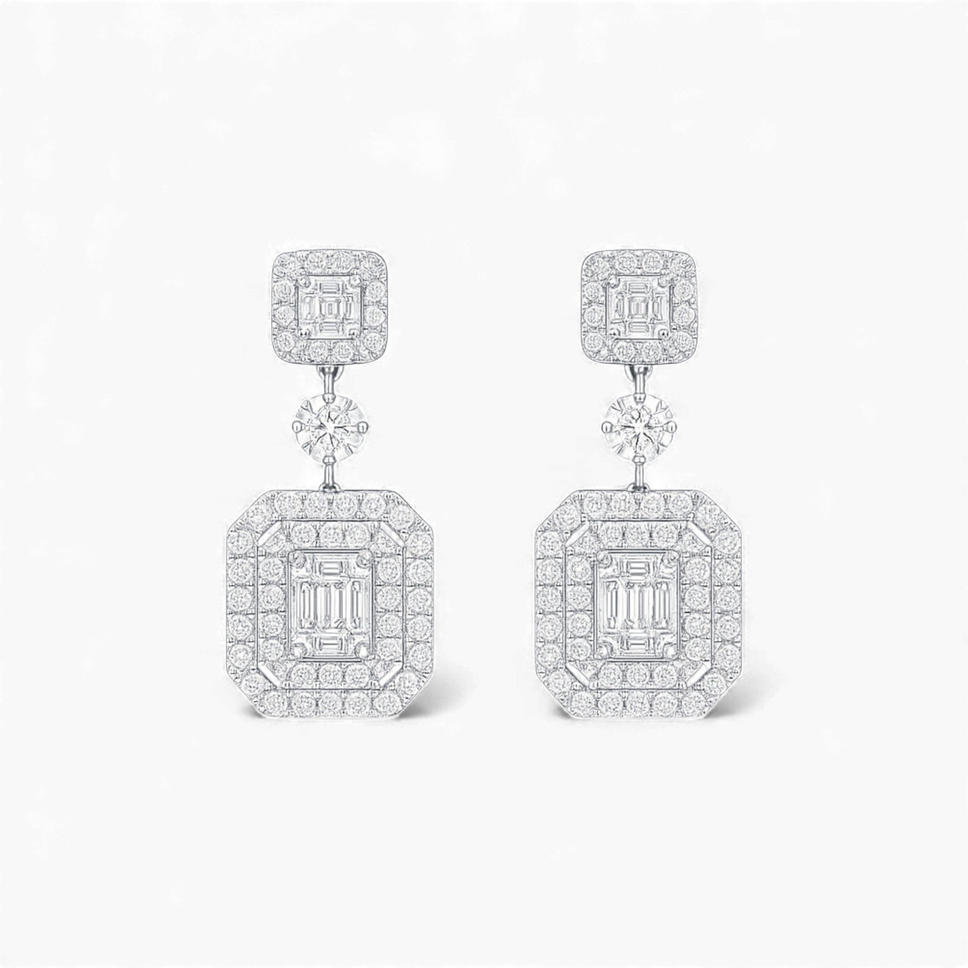 Pair of diamond earrings on a white background