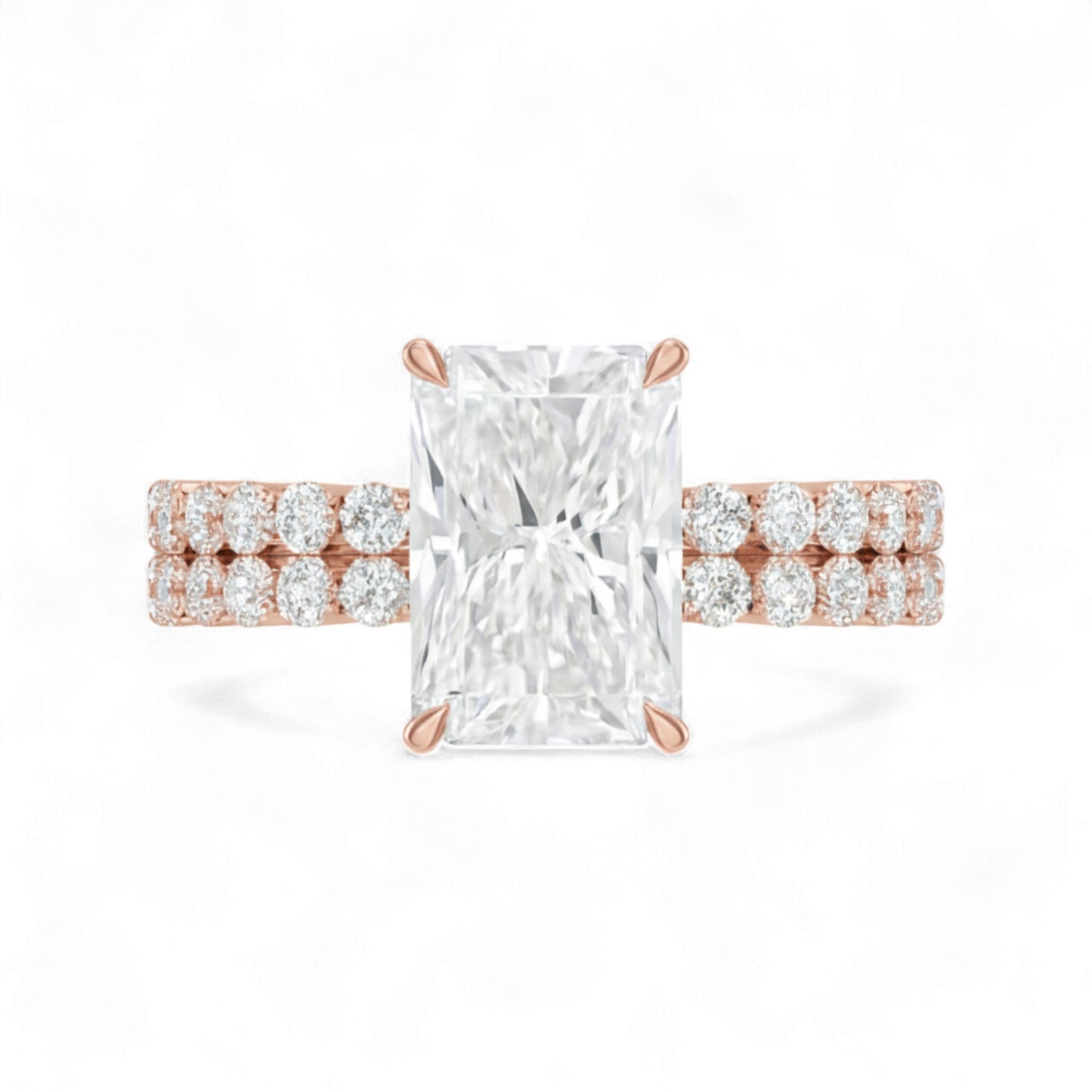 Rose gold ring with a large diamond and smaller diamonds on the band against a white background