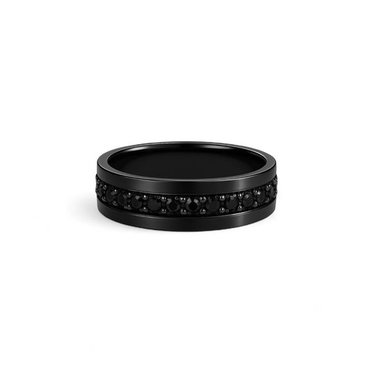 Black ring with embedded stones on a white background