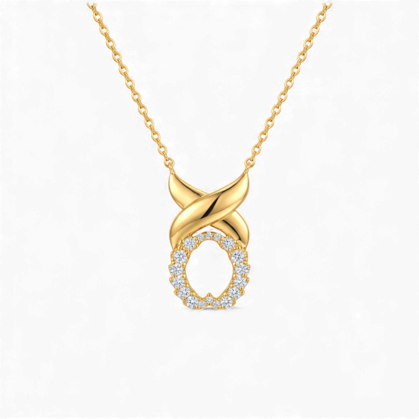 Gold necklace with a diamond-encrusted pendant on a white background