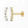 Gold earrings with diamond-like stones on a white background
