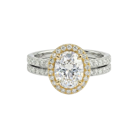 Two diamond rings, one gold and one silver, on a white background