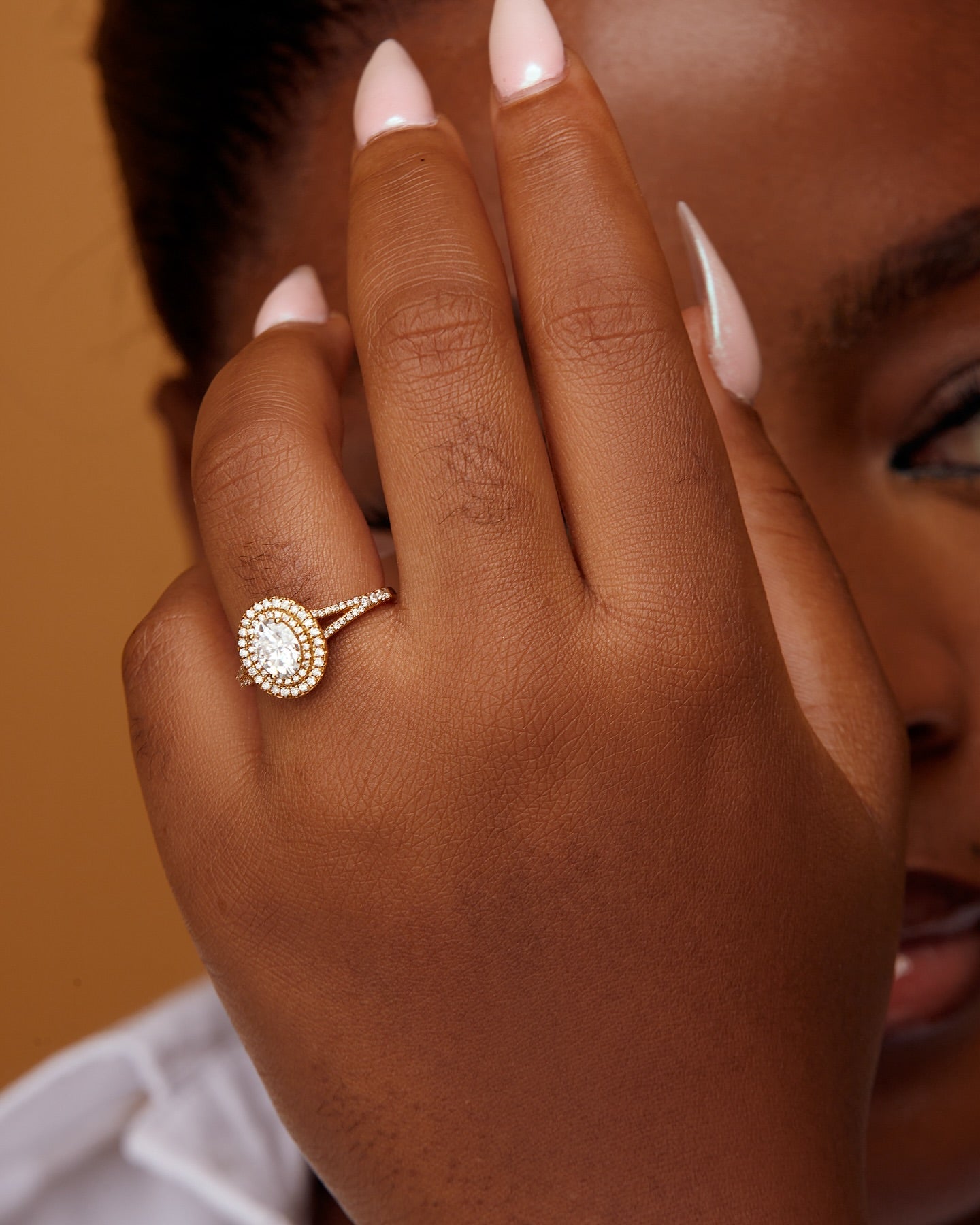 Kylie Oval Cut Moissanite and Diamonds Engagement Ring in 18K Gold