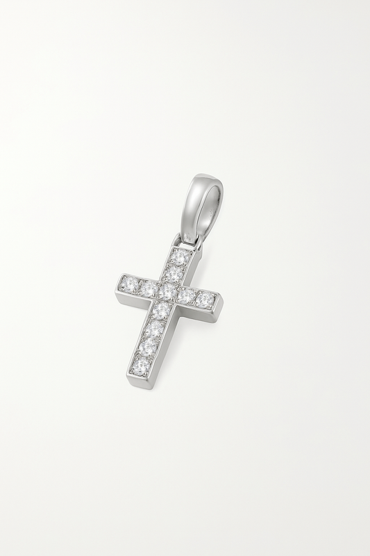 Silver cross pendant with embedded stones on a white background
