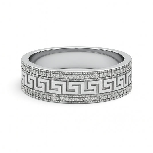 Silver ring with intricate design on a white background