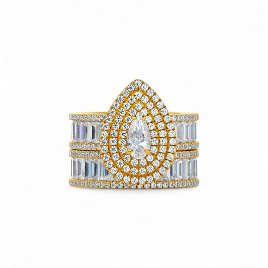 Gold and silver ring with diamond accents on a white background